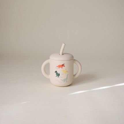 Mushie Silicone Training Cup met rietje Dino koop je bij Babywinkel